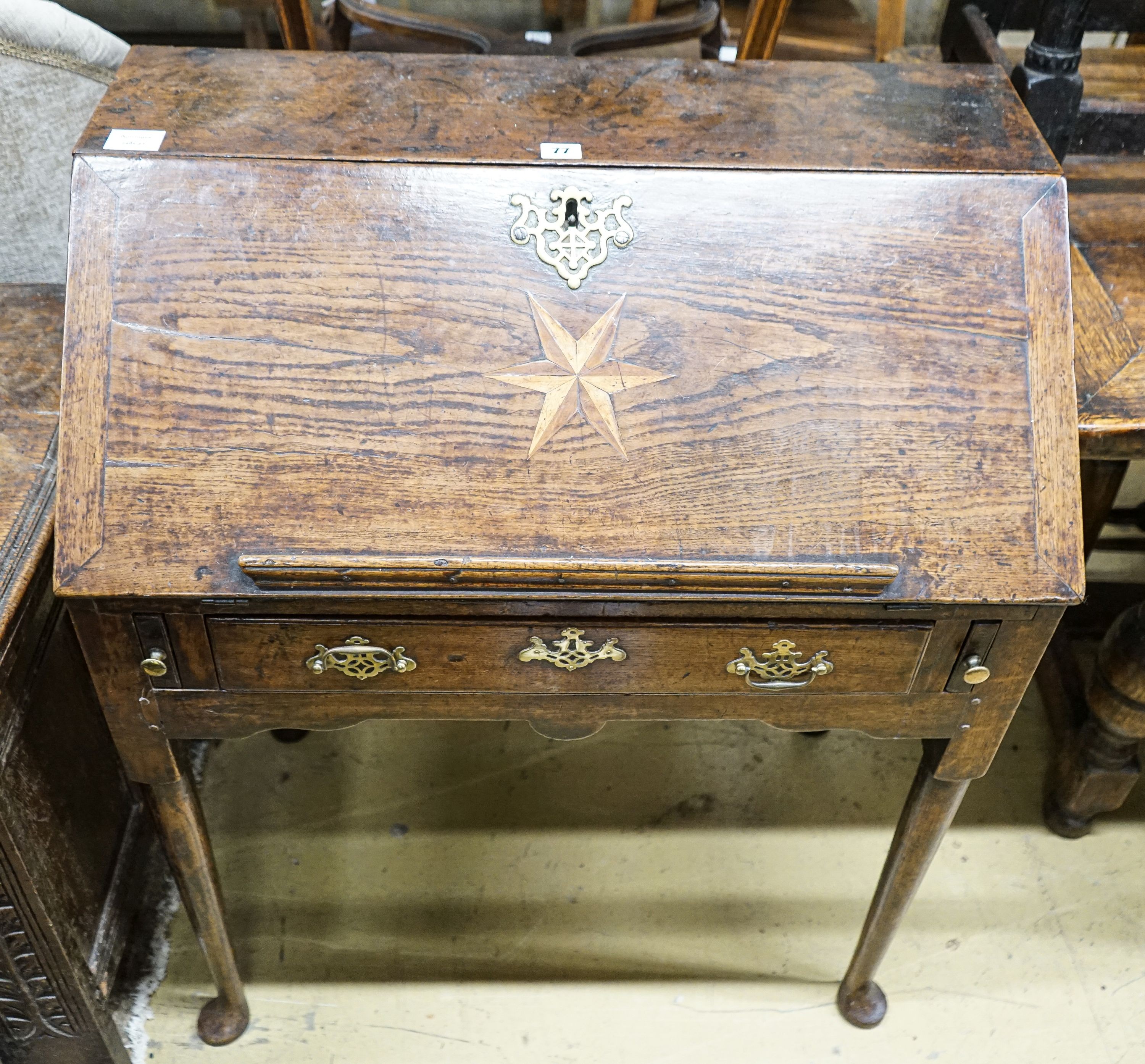 A mid 18th century inlaid oak and elm bureau, with fitted interior and single drawer, width 77cm, depth 45cm, height 94cm